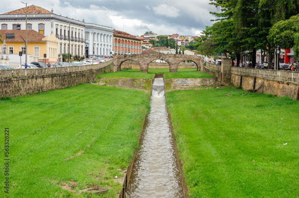 narrow stream, old bridge and ancient architecture of Sao Joao del Rei, Minas Gerais state, Brazil narrow stream, old bridge and ancient architecture of Sao Joao del Rei, Minas Gerais state, Brazil
