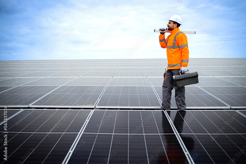 custom made wallpaper toronto digitalSolar panels installation for sustainable energy. Electrical engineer holding digital tablet with solar panels scheme and checking productivity.