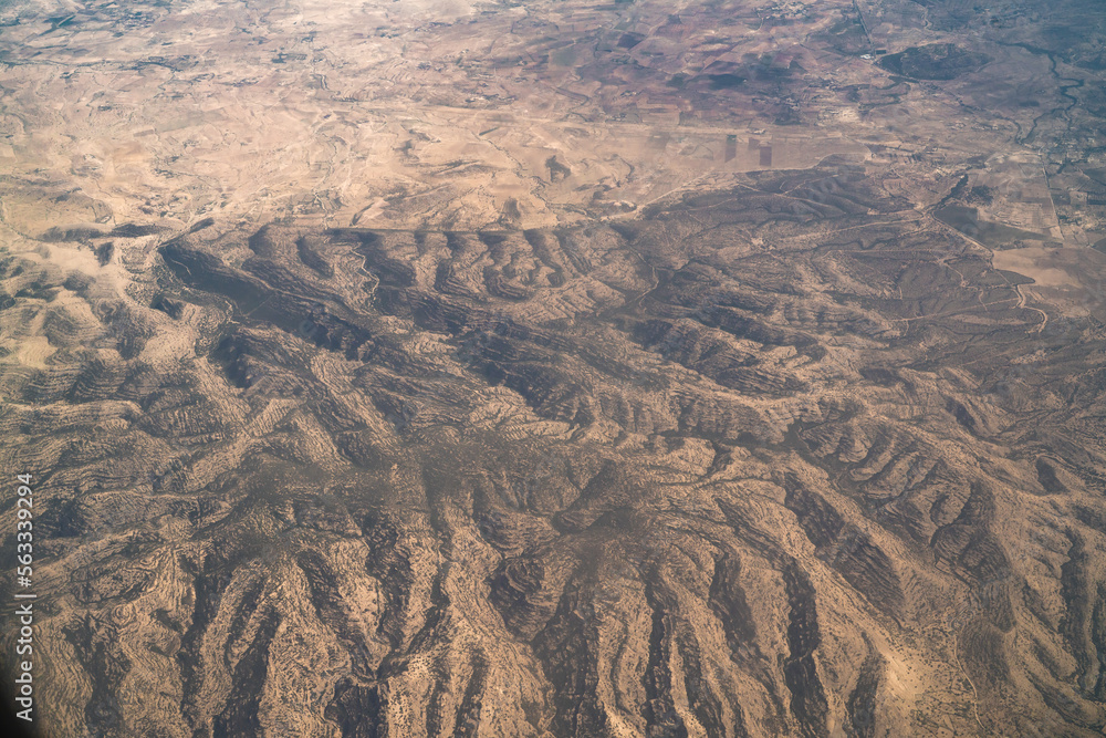 Fototapeta premium Aerial view of south landscape in Tunisia during the flight Monastir to Tozeur- Tunis