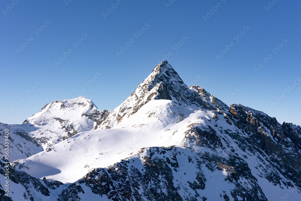 Snow-covered mountain on a sunny day