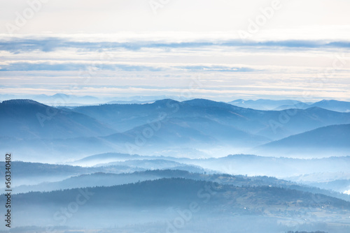 Beautiful landscape with layers of hills in the fog