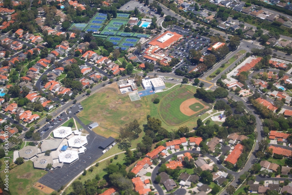 aerial view of suburban development rooftops and neighborhood streets in orange county california