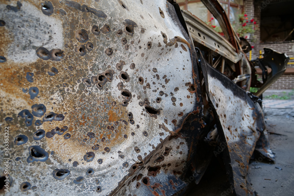 Fototapeta premium Russian terrorist army burned cars, houses and killed people in Irpin, Ukraine