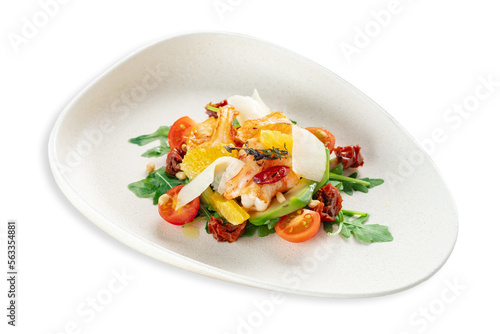 Warm salad with shrimp, arugula, parmesan and tomatoes, served on a plate, isolated on a white background