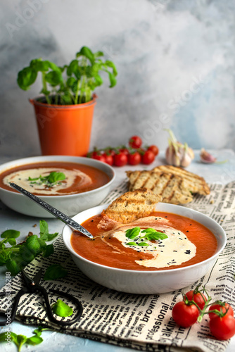 Tomatoe cream soup with cream and basil