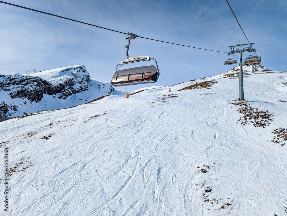 Ski slopes and mountains in Jungfrau ski resort in Swiss Alps, Grindelwald, Switzerland Ski slopes and mountains in Jungfrau ski resort in Swiss Alps, Grindelwald, Switzerland