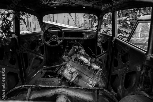 The interior of a burned-out car interior  inside view. car engine repair in garage. Old engine block.  part inside vehicle.