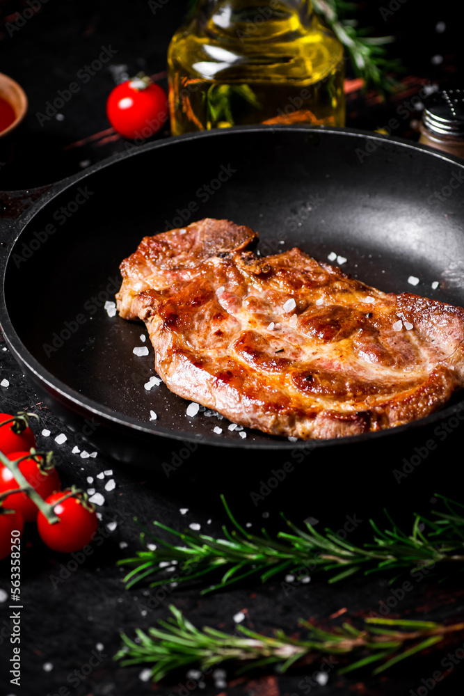 Frying pan with grilled steak. Frying pan with grilled steak.