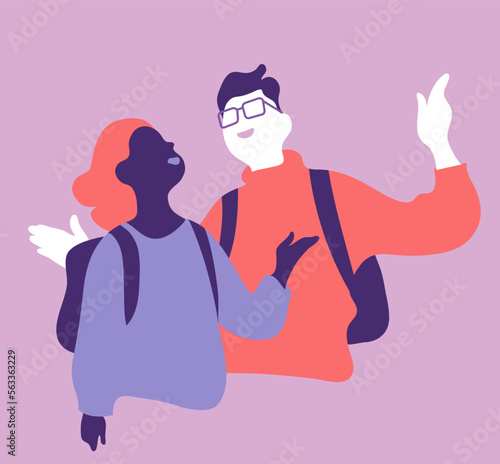 Due giovani studenti chiacchierano fuori dalla scuola