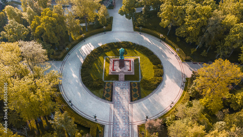 A statue of Taras Shevchenko in the center of the city park. Taras Shevchenko Park opposite the university