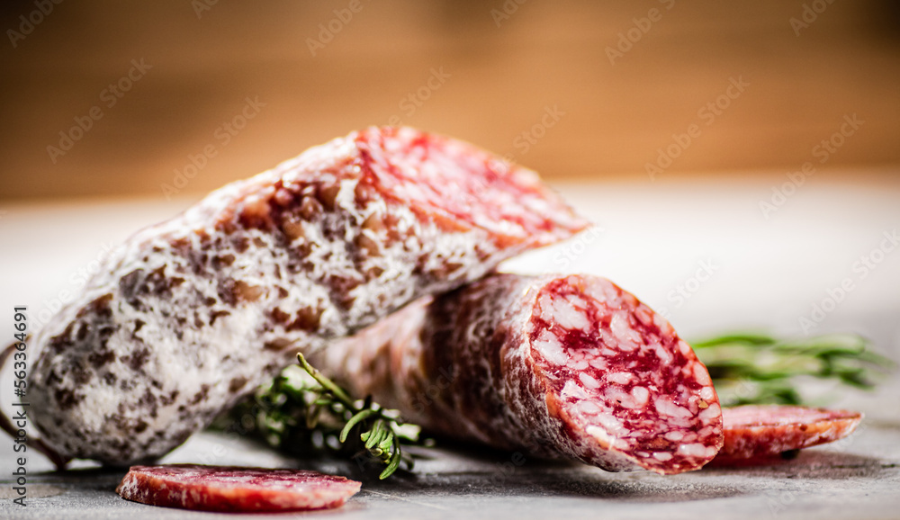 Delicious salami sausage with rosemary. Delicious salami sausage with rosemary.
