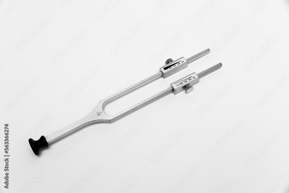 tuning fork C 128 on a white background with gradation tuning fork C 128 on a white background with gradation