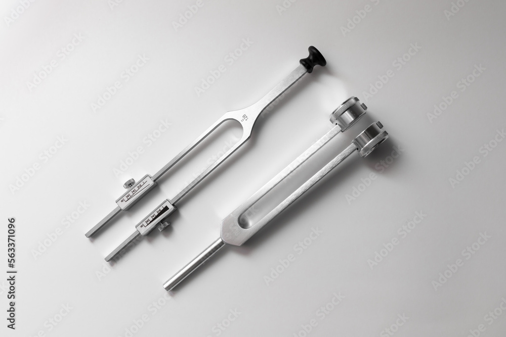 tuning fork C 128 on a white background with gradation tuning fork C 128 on a white background with gradation