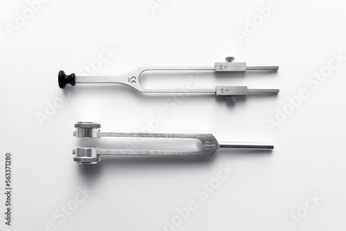 tuning fork C 128 on a white background with gradation © Светлана Назарова