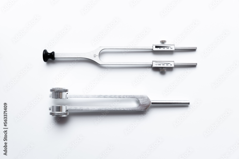 tuning fork C 128 on a white background with gradation tuning fork C 128 on a white background with gradation
