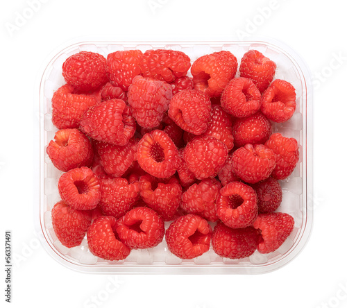 Whole fresh raspberries, in a clear plastic punnet, from above. Ripe, red and sweet fruits of Rubus idaeus, the cultivated European raspberry. Organic and vegan fruits. Isolated, close-up, food photo. photo