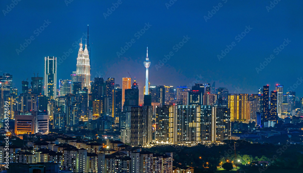 Naklejka premium Cityscape of Kuala Lumpur, Malaysia at night with blue sky
