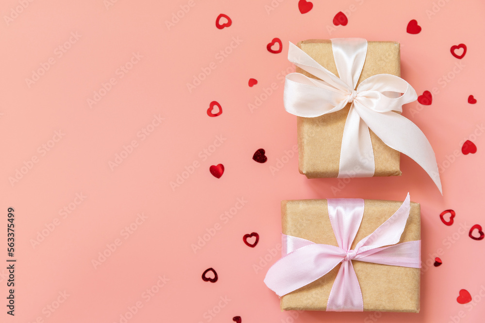 Valentine's Day background with gifts and hearts. Greeting card Valentine's day, Womans day, wedding, birthday or mothers day. View from above. Copy space. Valentine's Day background with gifts and hearts. Greeting card Valentine's day, Womans day, wedding, birthday or mothers day. View from above. Copy space.