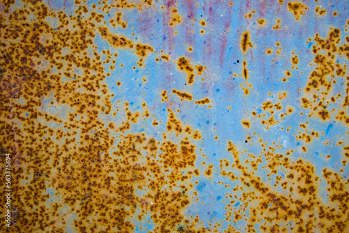 Old cracked paint in craquelure on a rusty metal surfaceGrunge rusted metal texture. Rusty corrosion and oxidized background. Worn metallic iron rusty metal background.