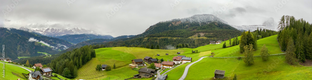 Scenic alpine landscape with village and pastures in South Tirol
