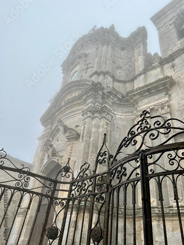 Church of Santa Maria di Loreto. Petralia Soprana. Sicily Italy. exterior facade with fog photo