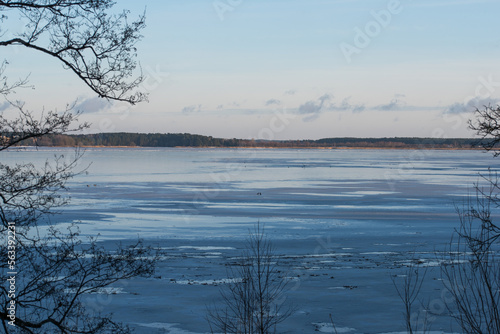 Winter lake. Snowy cold winter. Ice drift photo. Spring is coming. Winter inspiration