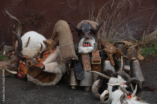 Breznik, Bulgaria - January 21, 2023: Unidentified people with traditional Kukeri costume are seen at the Festival of the Masquerade Games Surova in Breznik, Bulgaria photo