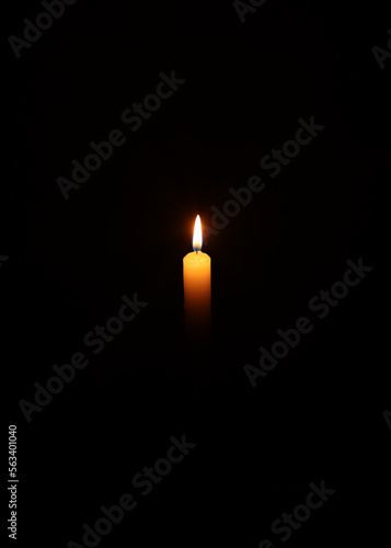 Burning candle at night. Spirituality and faith, light in the dark