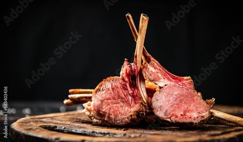 Rack of lamb grill on a cutting board. 