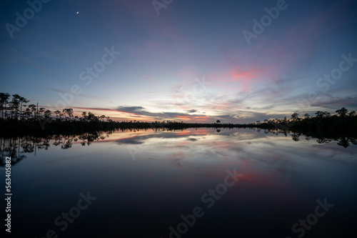 Colorful twilight cloudscape over and reflected in Pine Glades Lake in Everglades National Park  Florida..