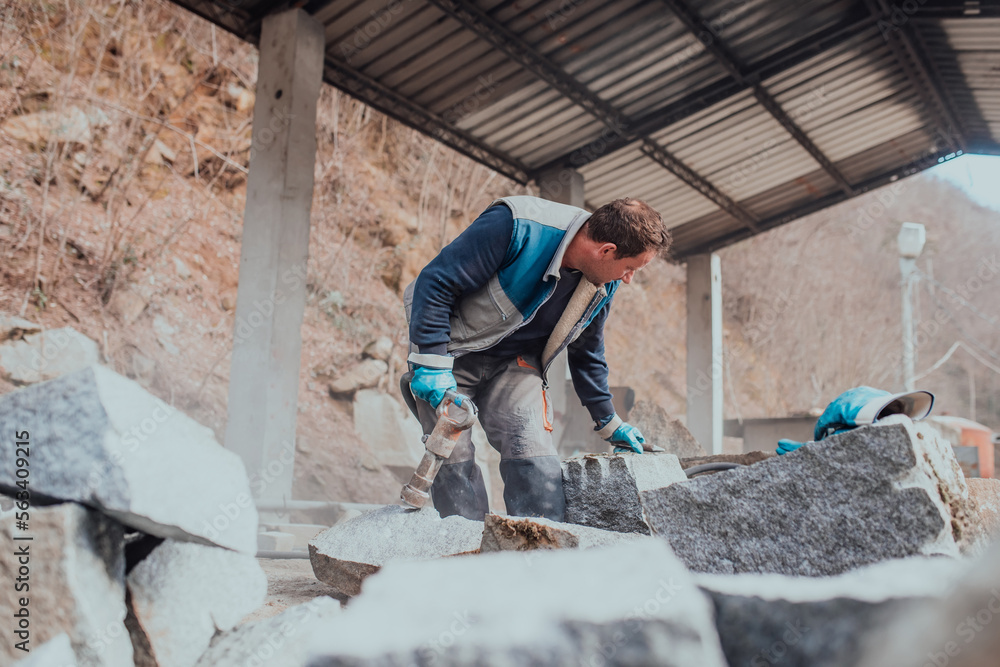 A stone pierces a factory worker. Heavy stone processing industry A stone pierces a factory worker. Heavy stone processing industry