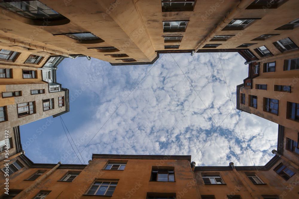 piece of the blue sky with clouds in iconic famous yard-well in Saint Petersburg, Russia