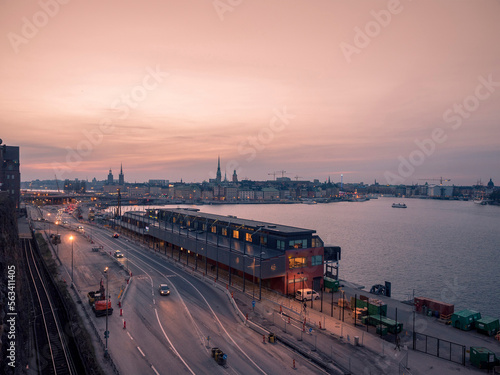Aerial view of Stockholm at night with pink sunset.