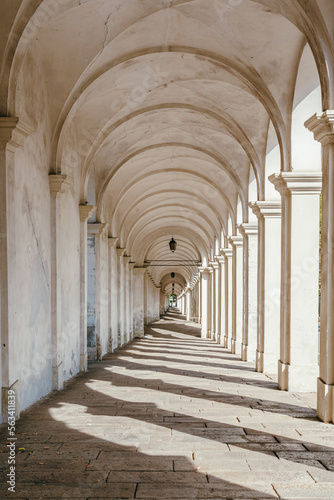 Historic buildings, Marble corridor in sunlight, Arcades of Mount Berico in Vicenza, Italy