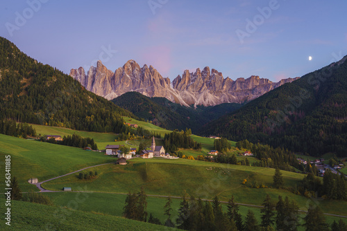 Dolomite mountain landscapes, beautiful small village in Val di Funes, with church and mountains in Dolomite Alps, Italy