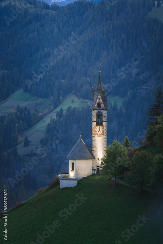 Small church in the mountain at sunset and night, Chiesa di Santa Barbara in Dolomite Alps, Italy