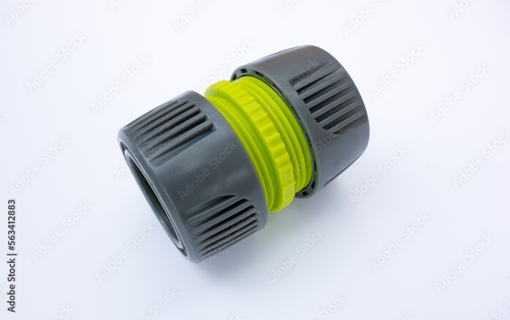 Plastic connecting element for garden hose.Water hose extension on white isolate. Plastic connecting element for garden hose.Water hose extension on white isolate.