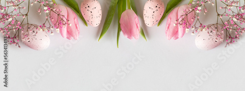 Easter background. Happy easter eggs. Easter eggs. Happy Easter card. Multi-colored Easter eggs. Tulips. Banner. Copy space