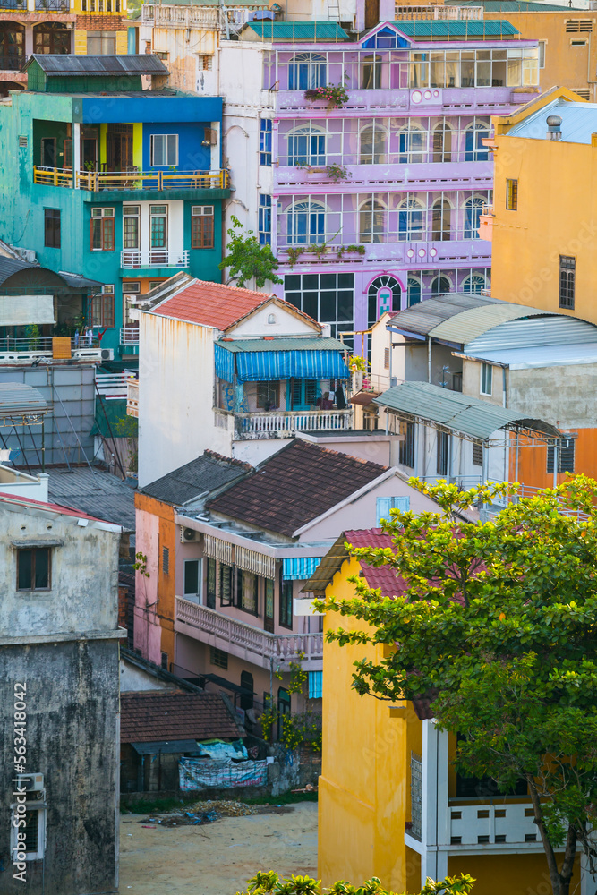Fototapeta premium Telephoto view of congested multi coloured buildings of various heights at Hue in Vietnam