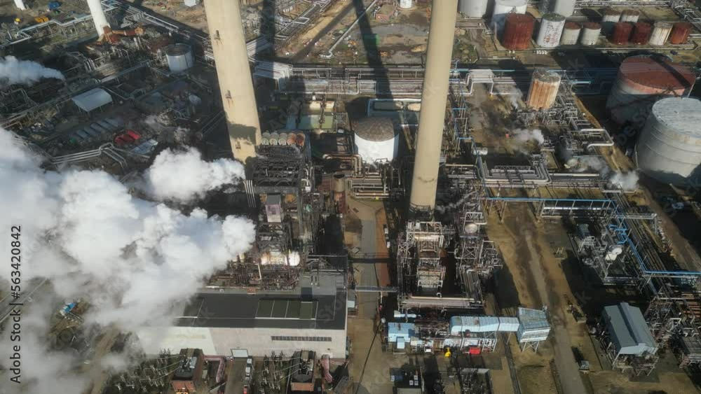 Oil refinery aerial view, shot from a drone. Production of oil and chemicals. Oil refinery aerial view, shot from a drone. Production of oil and chemicals.