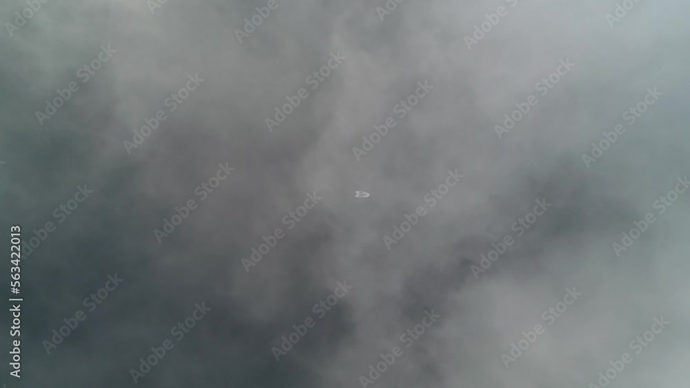 Fishing boat on the Dnieper river in the fog. Kyiv, Ukraine. Aerial. Fishing boat on the Dnieper river in the fog. Kyiv, Ukraine. Aerial.