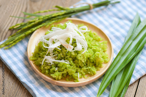 Thai dessert - pounded unripe rice food rice flakes cereal with coconut and sugar, Green rice sweet with ears of rice pandan leaf, Food dessert or snacks - Khao Mao name in Thailand photo