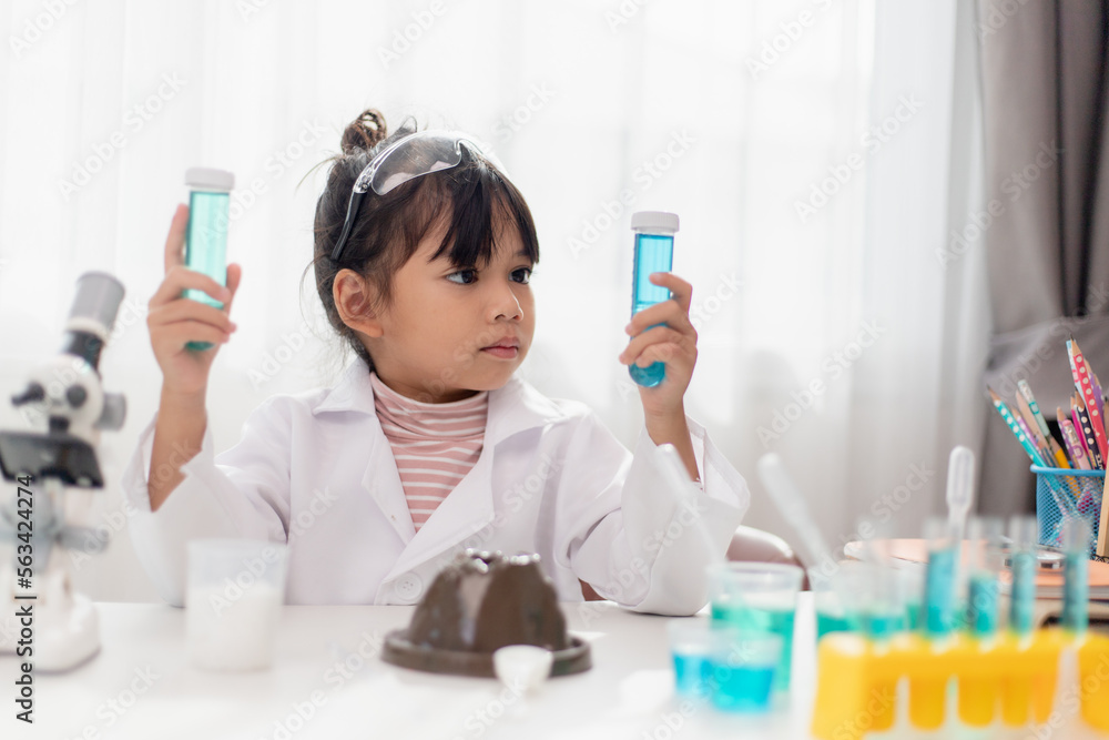 education, science, chemistry and children concept - kids or students with test tube making experiment at school laboratory education, science, chemistry and children concept - kids or students with test tube making experiment at school laboratory