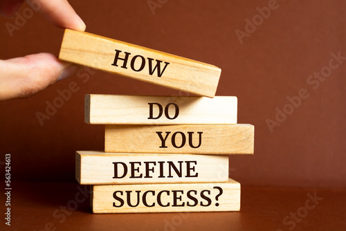 Wooden blocks with words 'How do you define success?'.