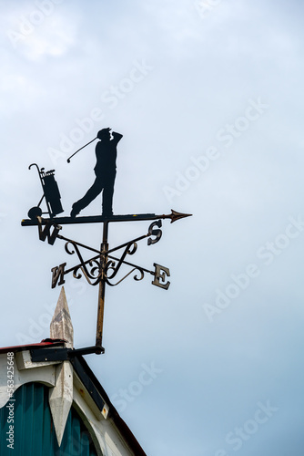 Silhouette of a weathervane representing a golfer, close up