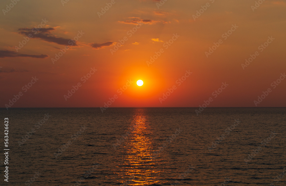 Dramatic sunset sky with clouds. Dramatic sunset over the sea. Natural Sunset Sunrise.