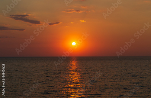 Dramatic sunset sky with clouds. Dramatic sunset over the sea. Natural Sunset Sunrise.