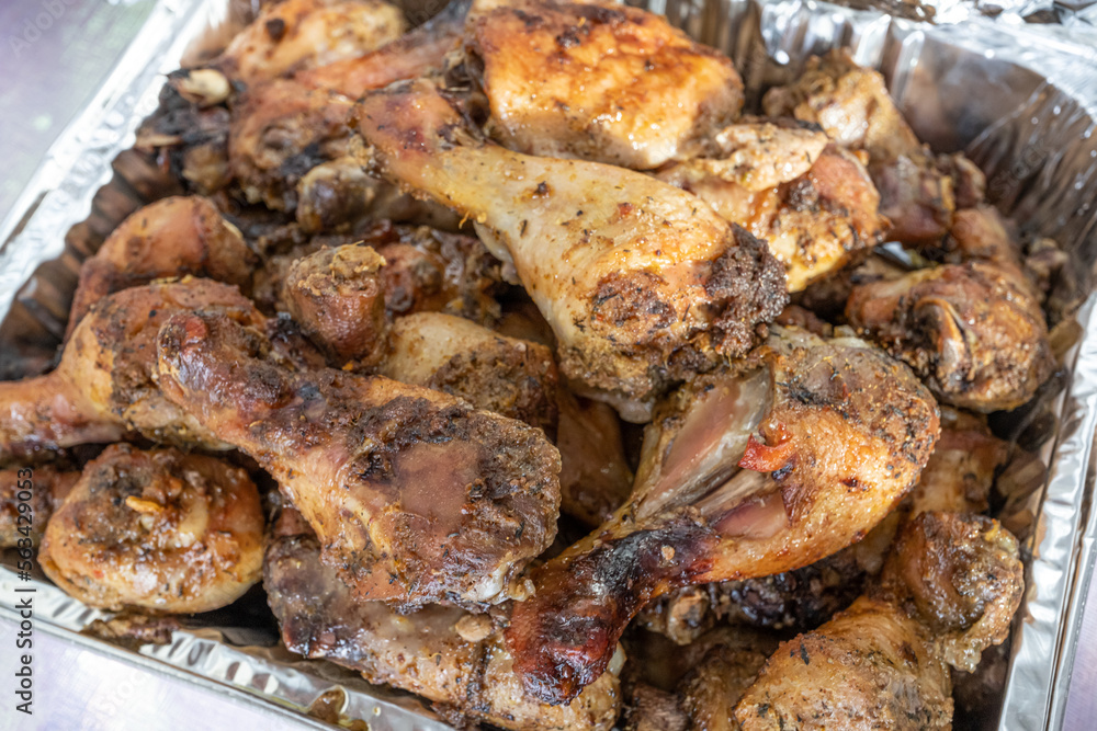 grilled chicken thighs ready to eat at a party grilled chicken thighs ready to eat at a party