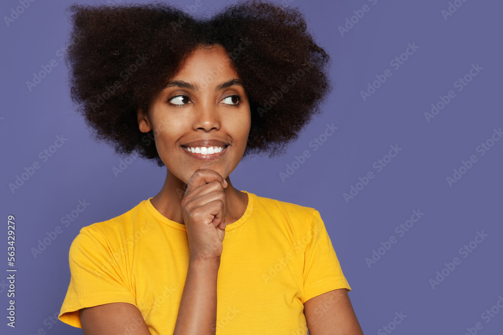 Portrait of smiling African American woman on purple background. Space for text Portrait of smiling African American woman on purple background. Space for text