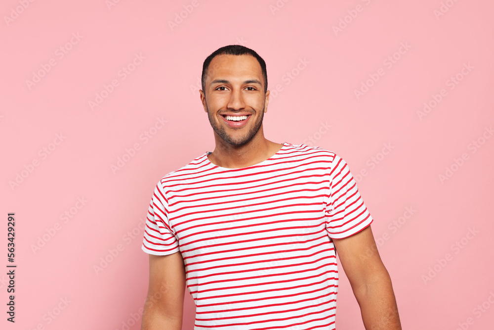 Portrait of happy African American man on pink background Portrait of happy African American man on pink background